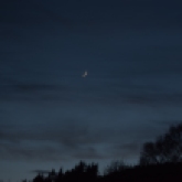 Slender waxing crescent Moon above Inverness